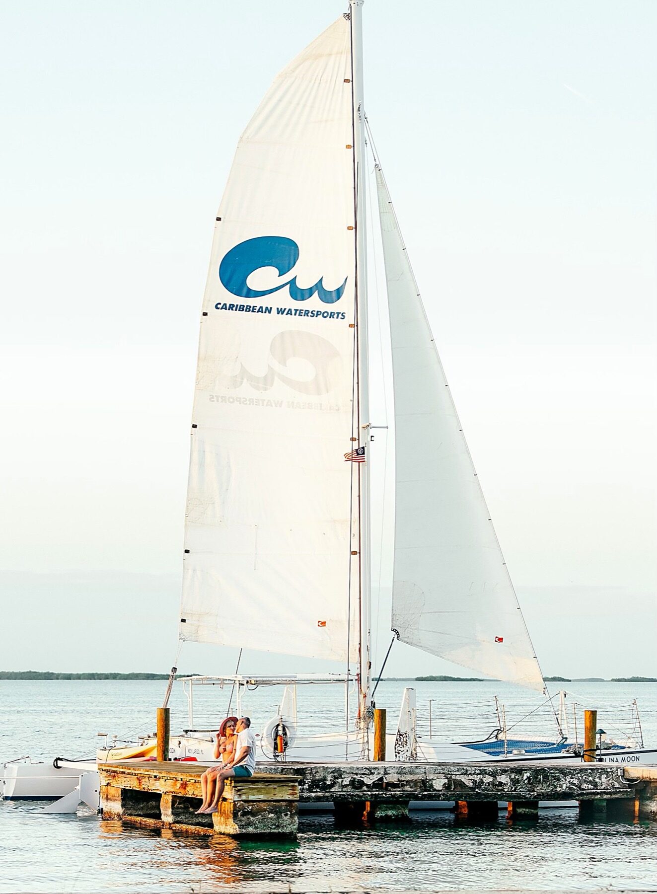 The Carolina Moon with its Caribbean Watersports sail, moored off a Key Largo dock