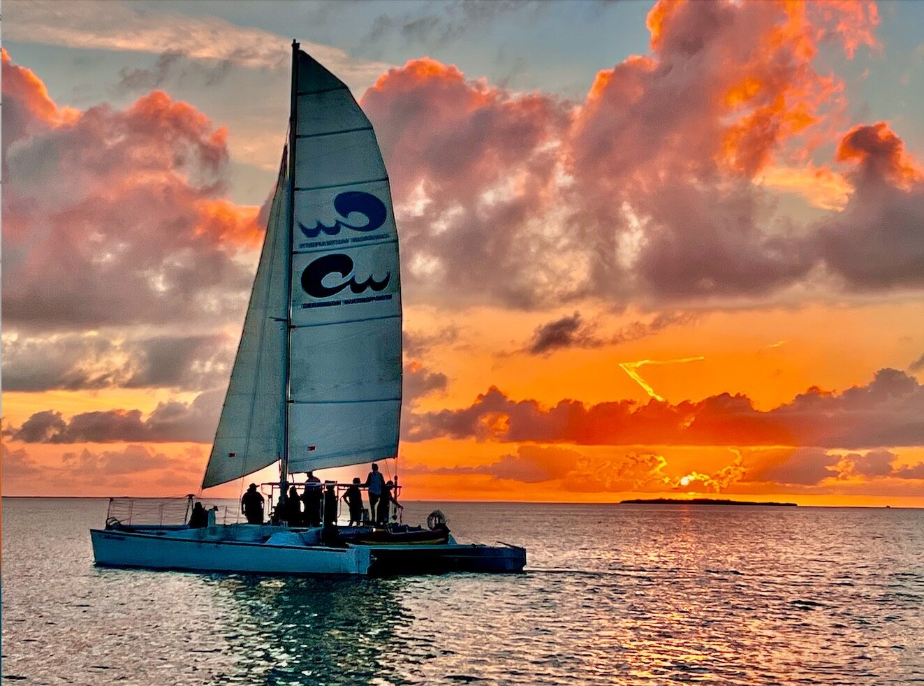 The Carolina Moon catamaran against a fiery Key Largo sunset