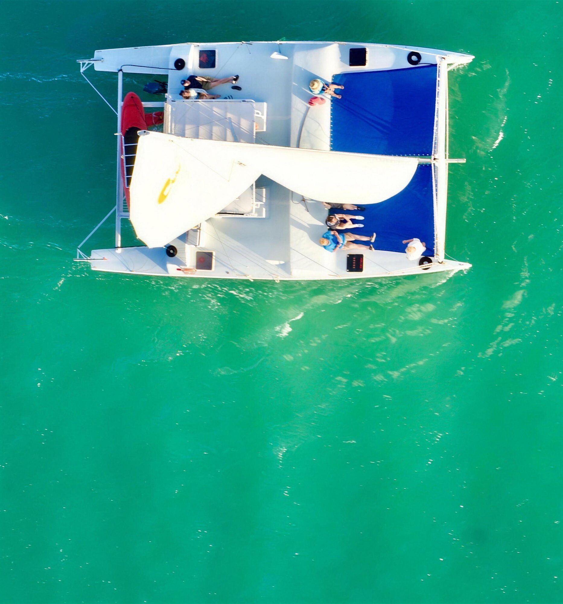 Overhead view of the Carolina Moon catamaran with guests aboard on a private Key Largo charter