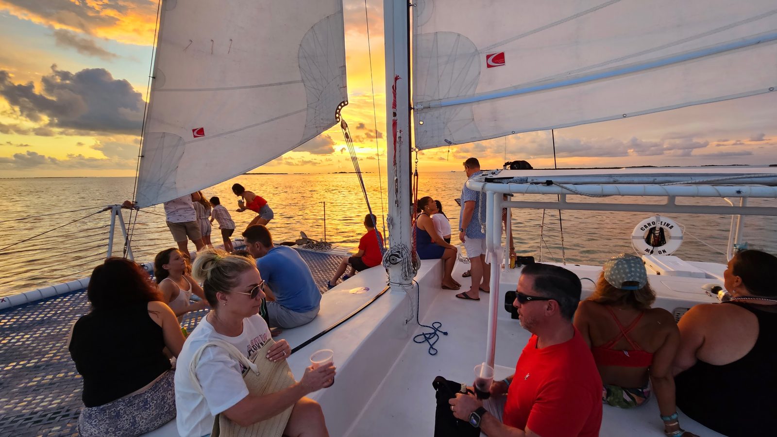 Champagne glasses raised as the sun sets over Florida Bay