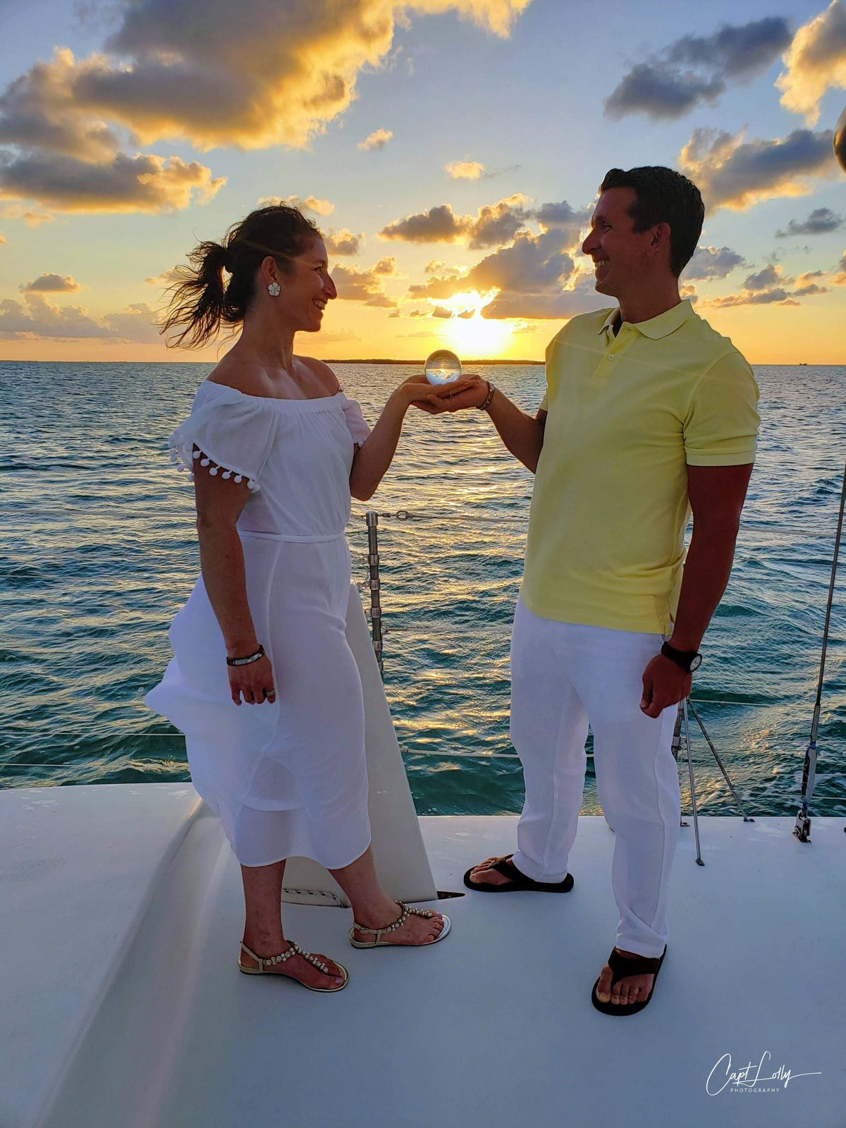 A couple celebrating an anniversary aboard the Carolina Moon at sunset